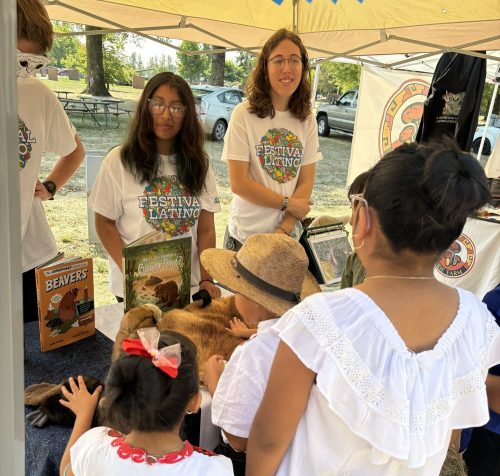 Photo of Youth Watershed Council students tabling at an outreach event.